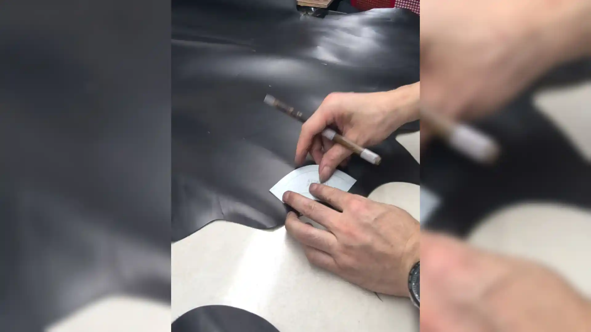 The master of the shoe factory cuts the entire grain leather
